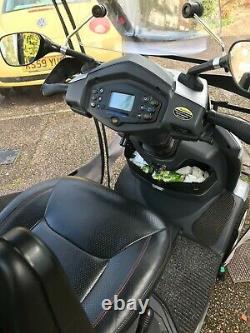 Royale four wheel Electric Mobility Scooter -silver, good condition with cover